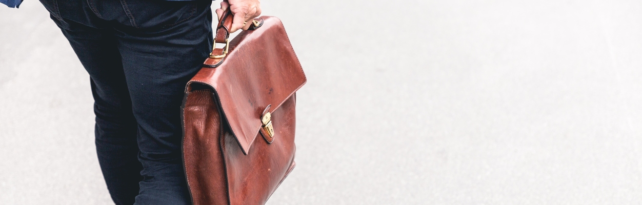 Individual with leather briefcase